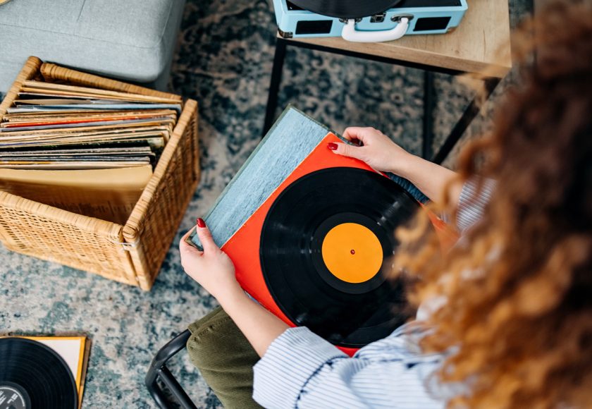 Woman holding vinyl records.